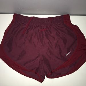 Maroon Nike running shorts